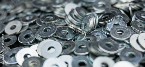 Set of metal washers in the foreground photo