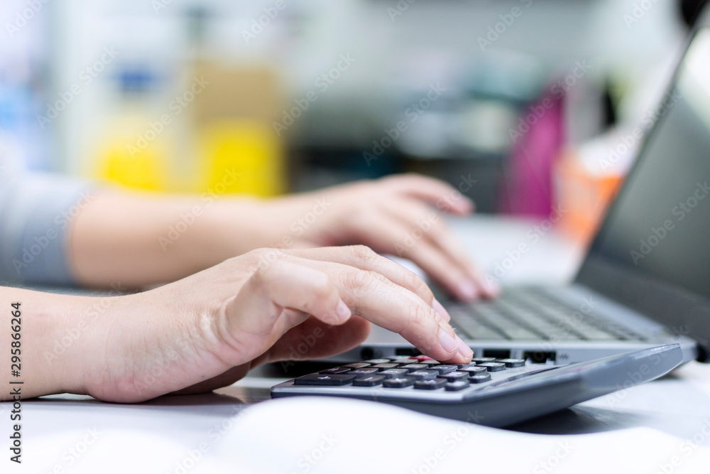 Business concept; Close Up hand using calculator in office. Business concept; Close Up hand using calculator in office.