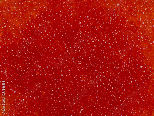 background salmon and trout red caviar. gourmet food close-up. macro shot, focus in the center