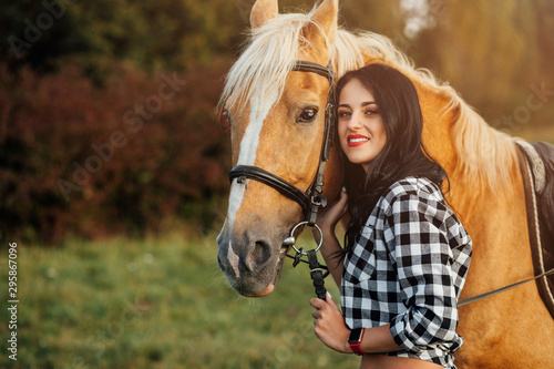 Young girl spending time with her horse