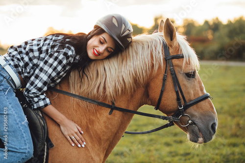 Beautiful young girl with her horse, autumn outdoors scene