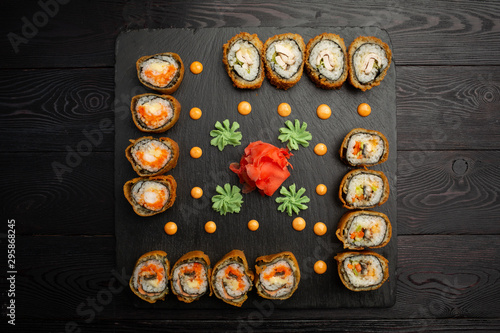 hotto set of sushi rolls on black stone photo