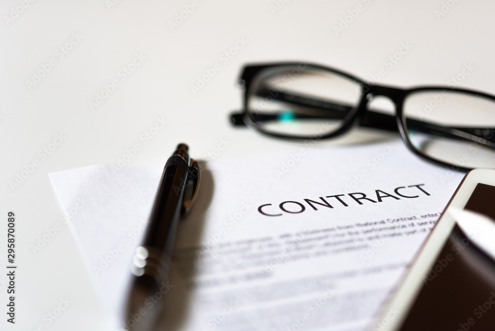White table with business document contract form paper and empty space to sign authorized signature, copy space available for text White table with business document contract form paper and empty space to sign authorized signature, copy space available for text
