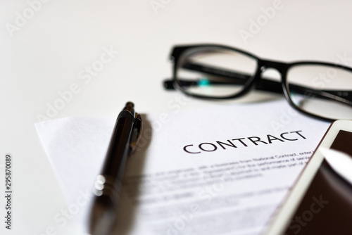 White table with business document contract form paper and empty space to sign authorized signature, copy space available for text
