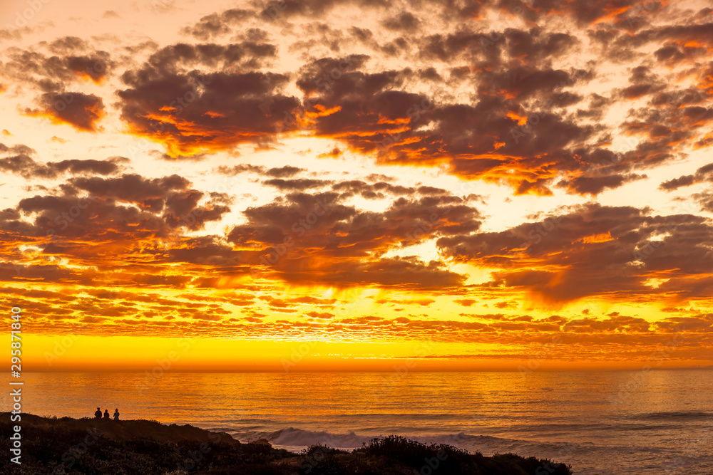 Fiery Sunset with Clouds, Ocean, Bluff, Couple Silhouette 