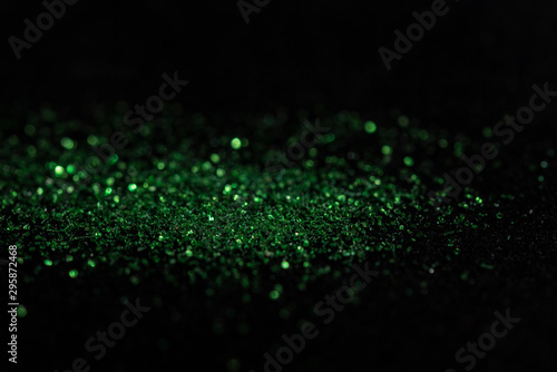 green bokeh from carborundum on black background photo