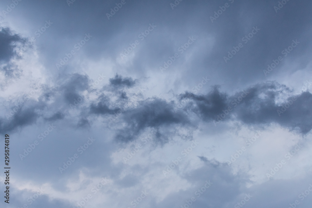 Dark rainy clouds with one even darker part in the middle Dark rainy clouds with one even darker part in the middle