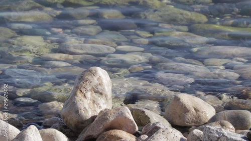 Calm sea waves on a stony shore