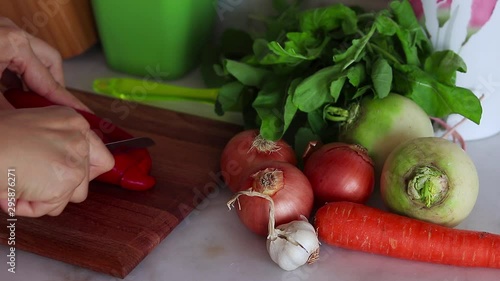 Woman preparing salad in the kitchen