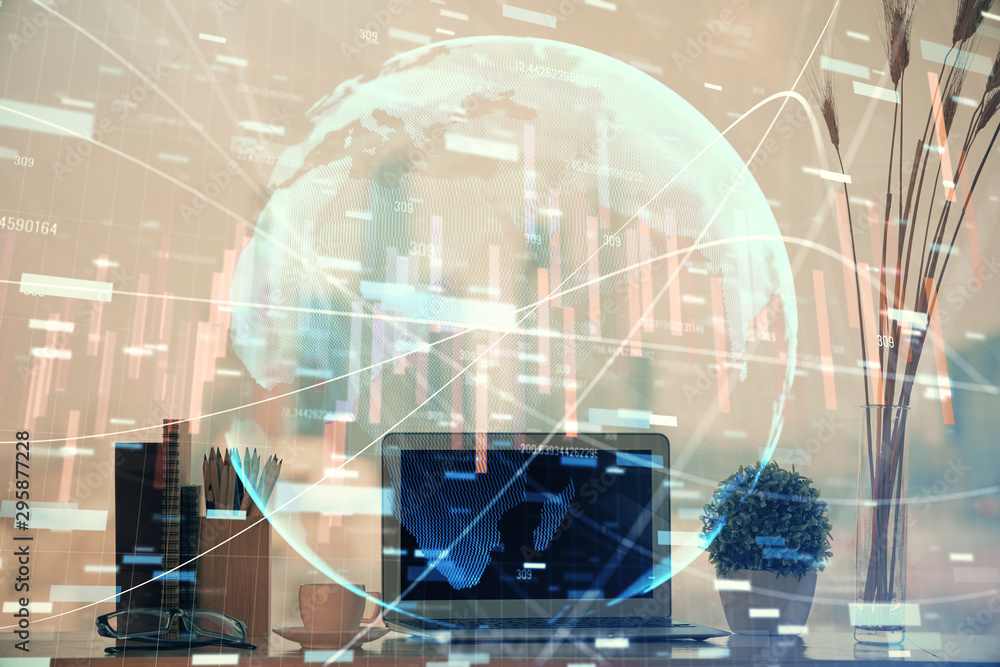 Financial chart drawing and table with computer on background. Double exposure. Concept of international markets. Financial chart drawing and table with computer on background. Double exposure. Concept of international markets.