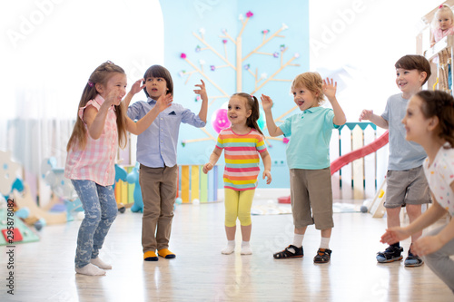 Group of happy children jum...