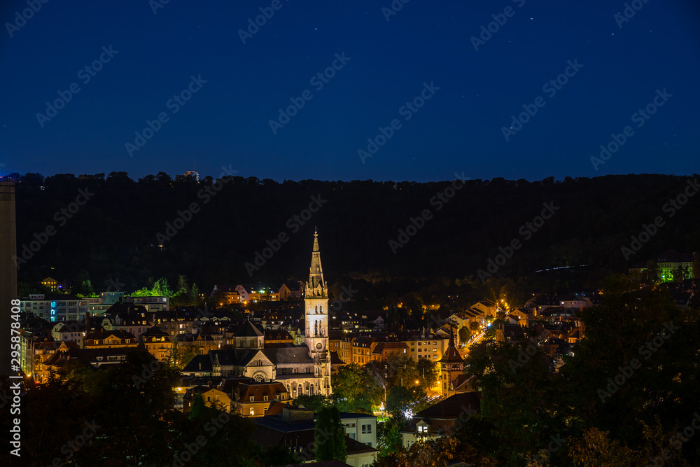 Germany, Magical night view over stuttgart heslach, erwin schoettle platz, mathaeuskirche, a beautiful cathedral, seen from above by night