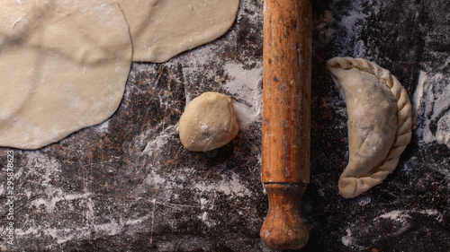 patty and tortas fritas dough and rolling pin over flour photo