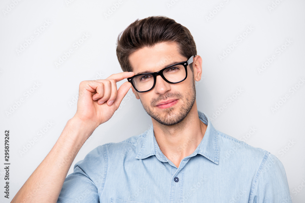 Close up photo of confident serious intelligent clever smart man staring at you intently with new eyewear isolated over color grey background