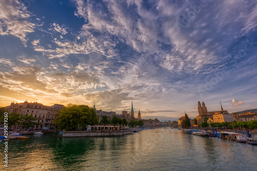 Panoramic view of historic Zurich downtown with Fraumunster and Grossmunster churches at lake zurich during sunset  Switzerland.