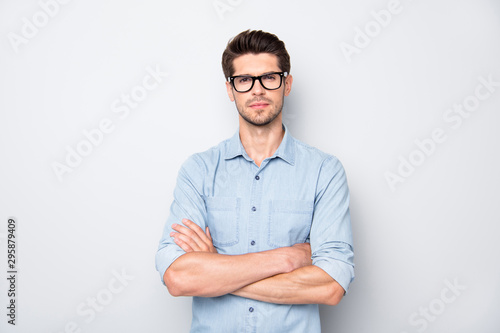 Fotografija Photo of serious confident business coach standing with arms crossed with bristl