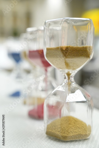 Collection of colorful hourglasses showing the passage of time