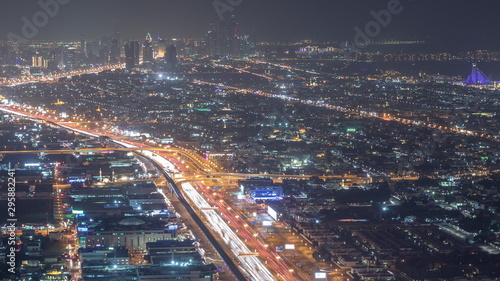 Aerial view to traffic on Sheikh Zayed road and intersection night timelapse, Dubai, United Arab Emirates