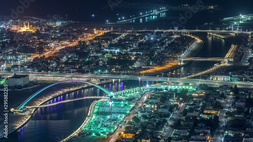Wallpaper Mural Dubai water canal with footbridge aerial night timelapse from Downtown skyscrapers rooftop Torontodigital.ca