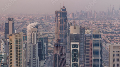 Dubai Downtown skyline futuristic cityscape with many skyscrapers and Burj Khalifa aerial timelapse.