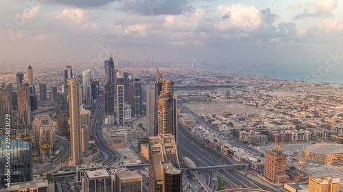 Dubai Downtown skyline futuristic cityscape with many skyscrapers and Burj Khalifa aerial timelapse.