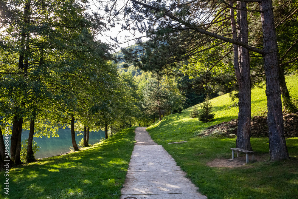 Footpath through forest by the Balkana lake in Bosnia and Herzegovina
