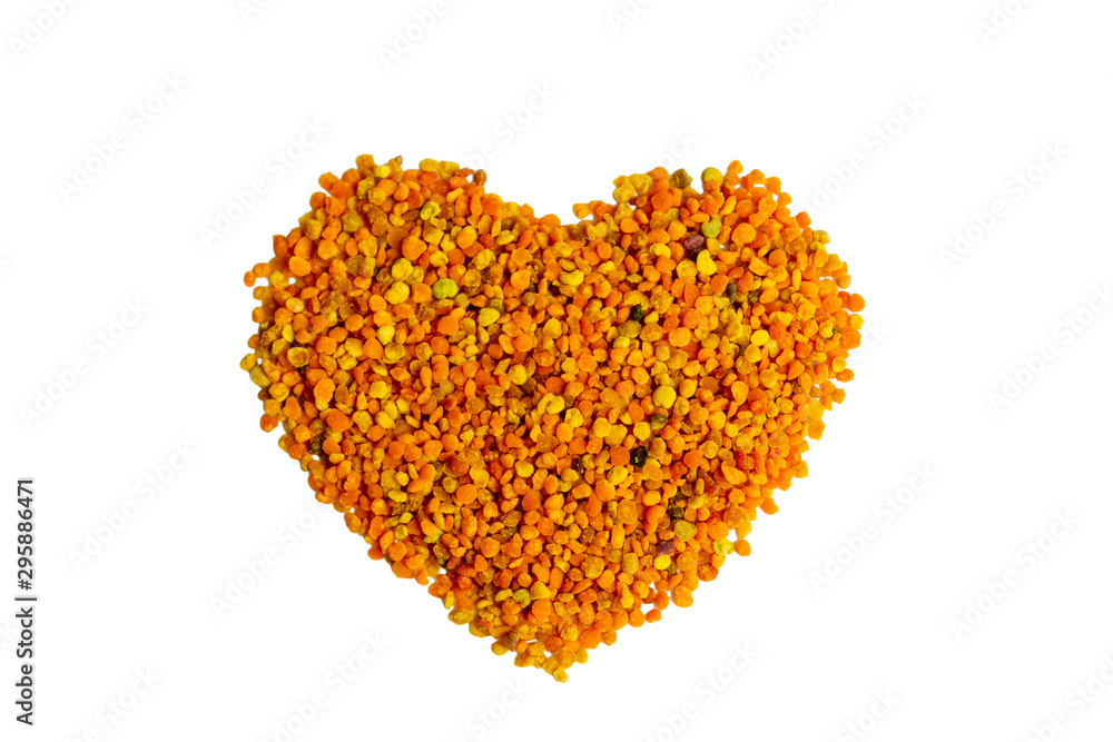 Isolated bee pollen grains in a heart shape on a white background. Healthy natural medicine for influenza Isolated bee pollen grains in a heart shape on a white background. Healthy natural medicine for influenza