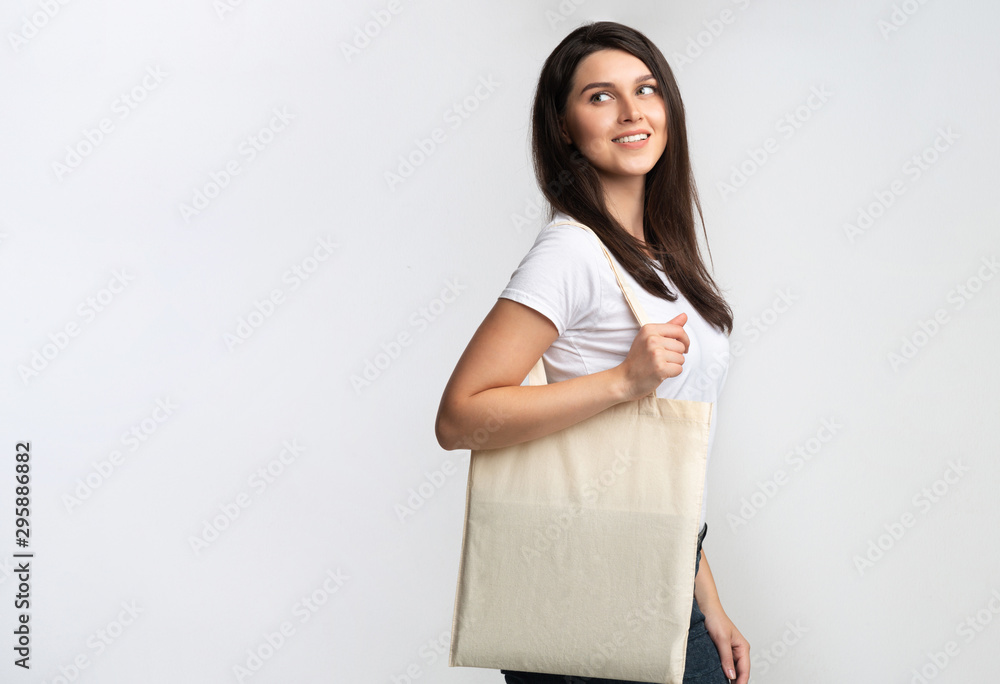 Lady Holding Blank White Eco Bag Standing In Studio Lady Holding Blank White Eco Bag Standing In Studio