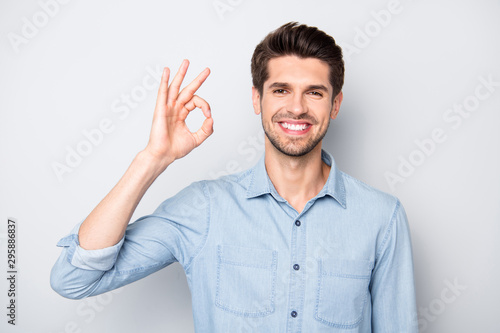 Portrait of confident cool smart entrepreneur promoter freelancer advertise sales show ok signs select suggest perfect offer option wear casual style clothe isolated over grey color background