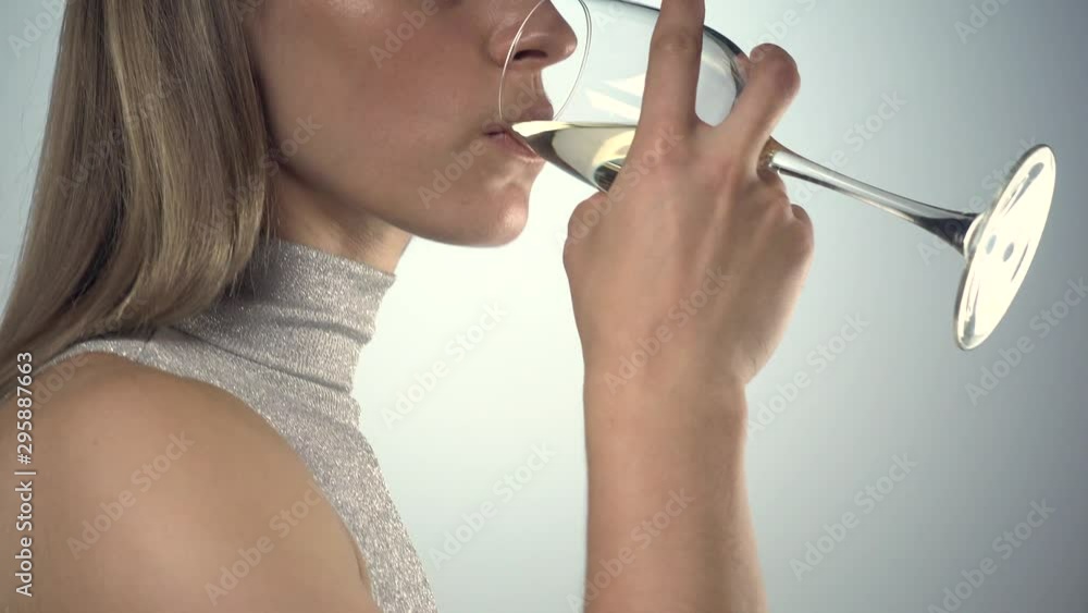 Woman drinking white wine, vertical panning Woman drinking white wine, vertical panning