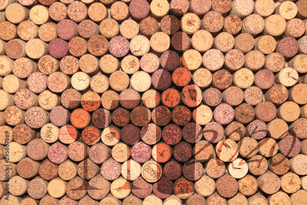 Abstract background of used old wine corks with silhouette of wine bottle and wine glasses as basis for menu or advertising in bar or restaurant Abstract background of used old wine corks with silhouette of wine bottle and wine glasses as basis for menu or advertising in bar or restaurant