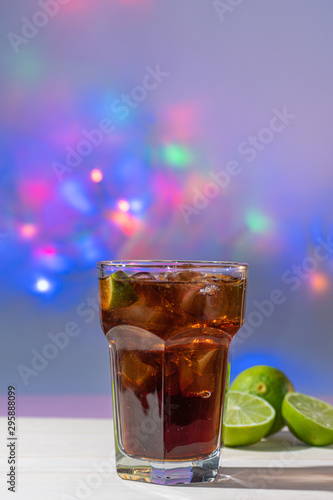 drink of cuba libre with colorful lights background