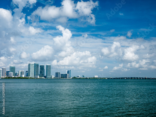 view of Miami downtown skyline at sunny and cloudy day with amazing architecture © christian