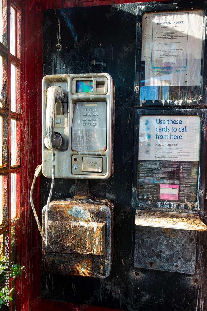 Shabby red traditional British red telephone kiosk Shabby red traditional British red telephone kiosk