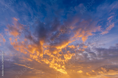 Fototapeta Naklejka Na Ścianę i Meble -  sunset on dark background.Vivid orange cloud sky.