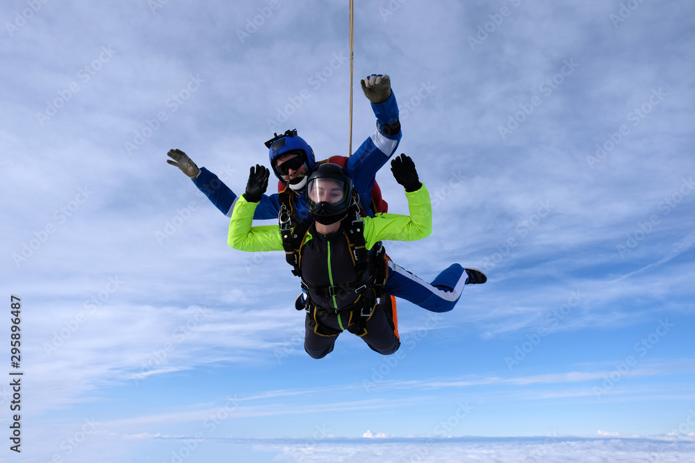 Skydiving. Tandem jump. An instructor and a passenger are flying in the sky. Skydiving. Tandem jump. An instructor and a passenger are flying in the sky.