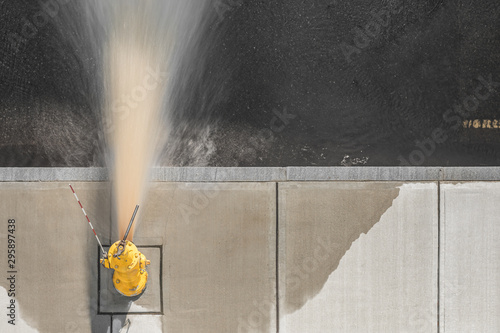 City fire hydrant flushing from above.