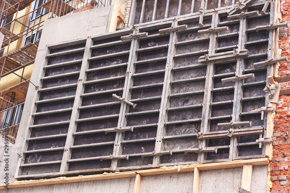 part of the concrete wall on the construction site,pressed down by an iron plate part of the concrete wall on the construction site,pressed down by an iron plate