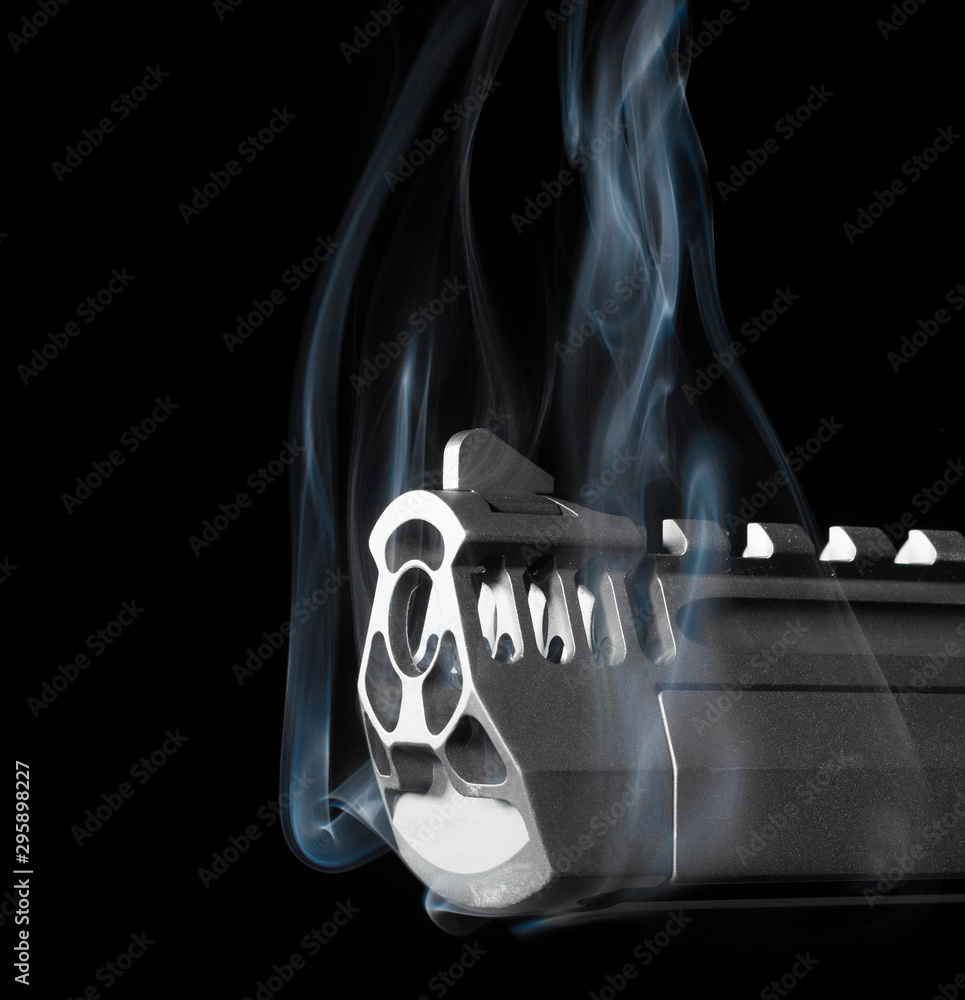 Pistol smoking on a black background