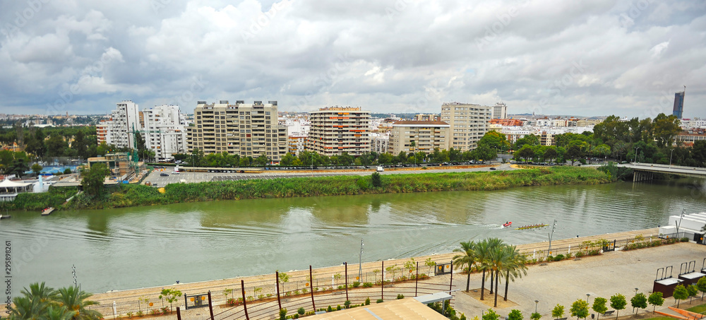 Fototapeta premium Skyline of modern Los Remedios neighborhood and Guadalquivir river in Seville, Andalusia, Spain