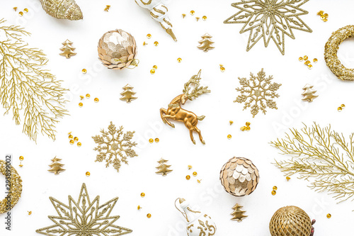 Gold christmas decoration on white background, flat lay, top view
