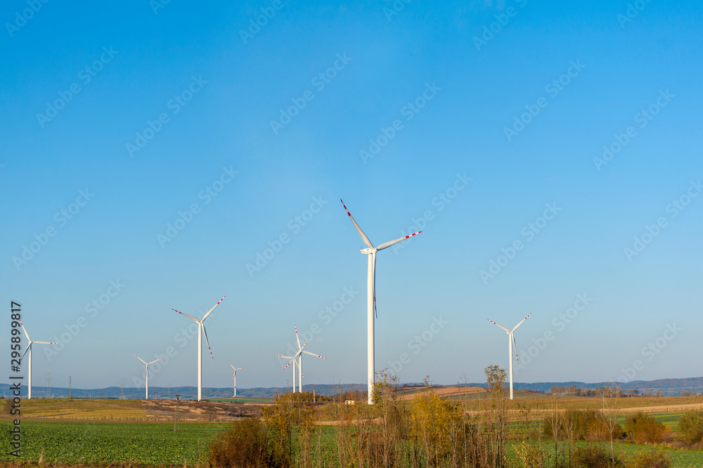 Wind turbines generating electricity. Electrical windmills. Wind turbines generating electricity. Electrical windmills.