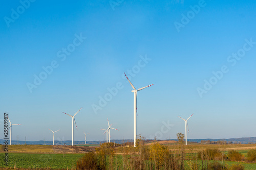 Wind turbines generating electricity. Electrical windmills.