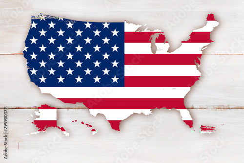 Obraz na płótnie The USA flag embedded in the outline of the state borders on a wooden background w salonie