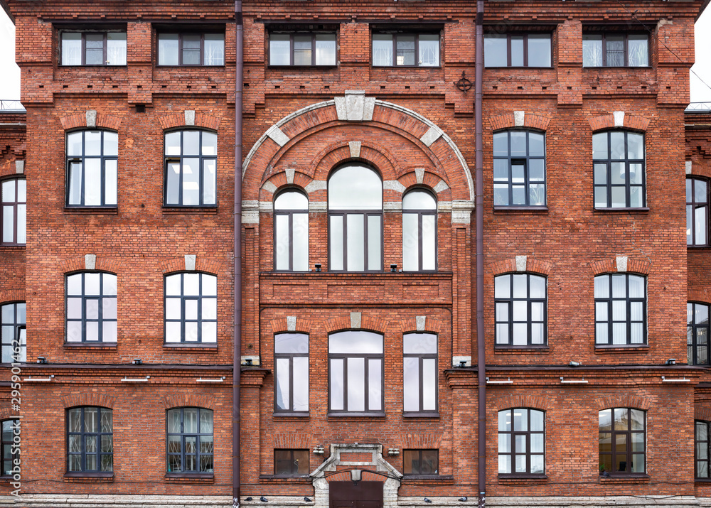 Fototapeta premium Vintage architecture red brick facade building front view