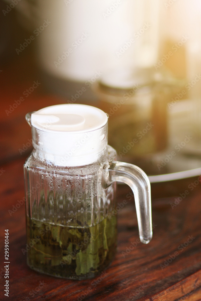 Hot Green tea leaves are boiled in a glass jar. Hot Green tea leaves are boiled in a glass jar.