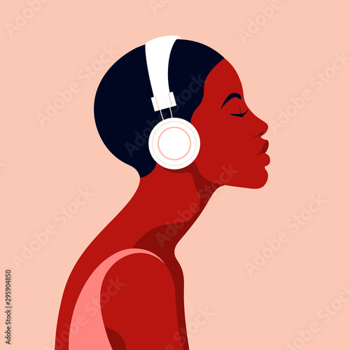 The girl listens to music on headphones. Music therapy. Profile of a young African woman. Musician avatar side view. Vector flat illustration