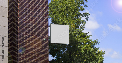 Blank white square banner mock up on brick wall mounted photo