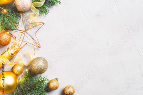 Christmas festive background with golden christmas balls, fir branches and champaign bottle