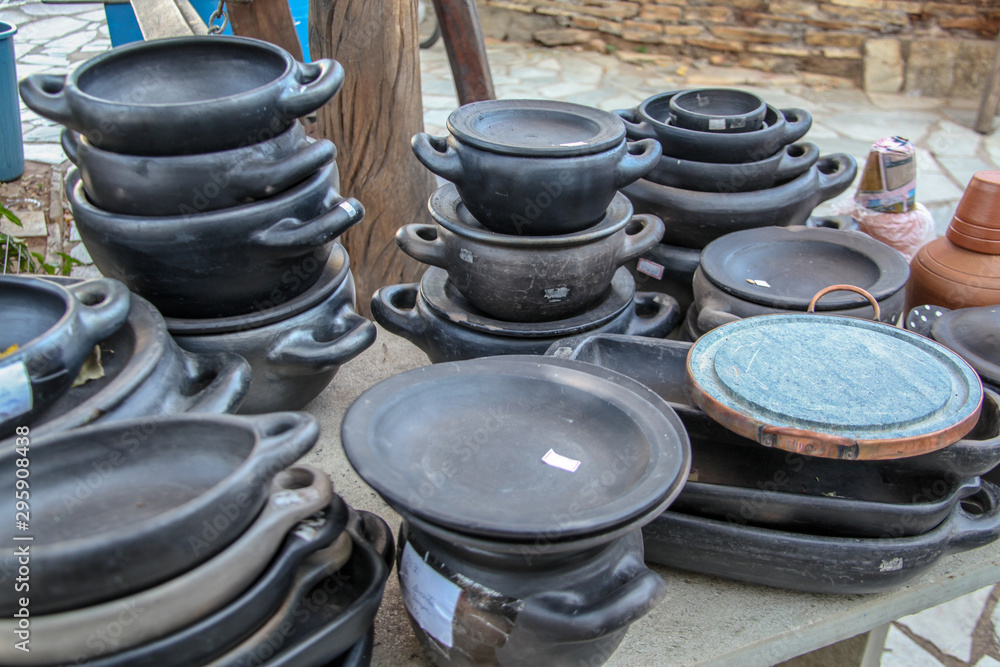 Clay pots, one of the oldest, fastest-cooking, hand-crafted cooking utensils, receive a tannin tincture known as Clay pots, one of the oldest, fastest-cooking, hand-crafted cooking utensils, receive a tannin tincture known as